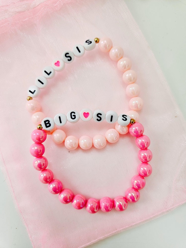 Setje met 2 armbandjes 'zusjes' roze variant