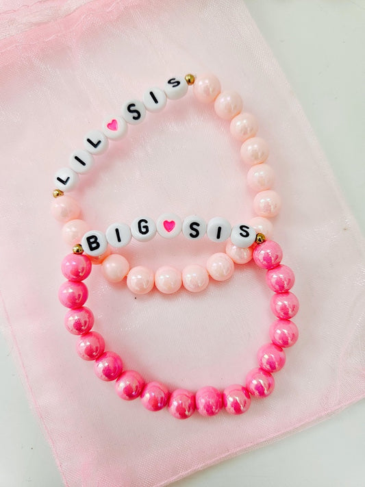 Setje met 2 armbandjes 'zusjes' roze variant